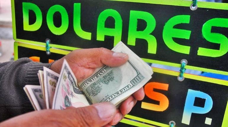 EL DÓLAR PARALELO  BAJA HASTA BS 14,60 PARA LA VENTA Y BS 14 PARA LA COMPRA